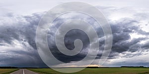 Panorama of black sky background with storm clouds. thunder front