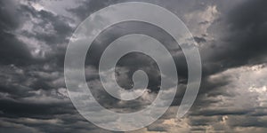 Panorama of black sky background with storm clouds. thunder front