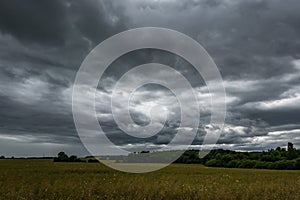 panorama of black sky background with storm clouds. thunder front