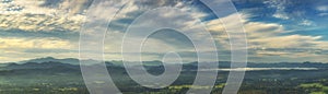 Panorama blue sky mountain panoramic landscape view fluffy white cloud summertime sunshine morning cloudscape. Blue skyline