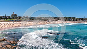 Panorama of Bondi beach on a hot sunny summer day with blue sky in Sydney Australia