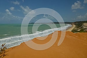 Panorama of brasilian beach bathed by ocean waves photo