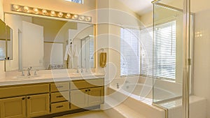 Panorama Built in bathtub and shower with glass door inside a beautiful bathroom