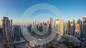 Panorama of Business bay Dubai night to day aerial timelapse.