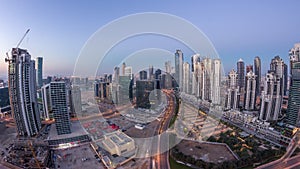 Panorama of Business bay Dubai night to day aerial timelapse.