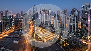 Panorama of Business bay Dubai night to day aerial timelapse.