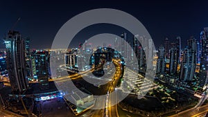 Panorama of Business bay Dubai night to day aerial timelapse.