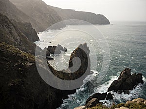 Panorama from Cabo Ortegal lighthouse of steep rocky cliff atlantic ocean bay of biscay Carino Cape Galicia Spain