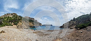 Panorama of the Cala dâ€™Egos sandy beach and surrounding cliffs, hidden gem of Mallorca, tourist destination for hikers