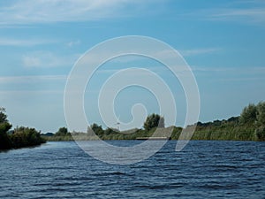 Panorama from a canal KÃ¼khernster Feart between Leeuwarden and Groningen in Friesland, The Netherlands