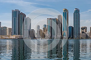 Panorama of the center of the Emirate of Sharjah, United Arab Emirates . Corniche area of Sharjah, UAE city