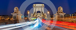 Panorama of Chain bridge at night with car light trails in Budapest Hungary