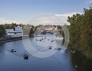 Panorama of Charles bridge over Vltava river and houses of Old Town, Prague, Czech Republic, golden hour light, summer