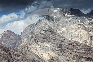 Panorama of Cima dei Preti summit with dramatic cloudy sky, Dolomites