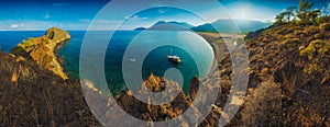 Panorama of Cirali beach and Olimpos mountain in a sunset