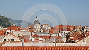 Panorama of the city of Dubrovnik, from the walls of the old city. Camera wiring on tiled roofs.