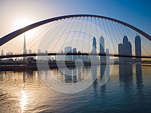 Panorama of the city early in the morning at dawn with a bridge over the city channel Dubai Greek. photo