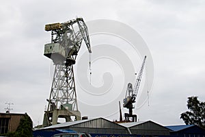 Panorama of the city of Gdansk. Port cranes on the background of city panorama.