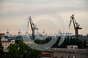 Panorama of the city of Gdansk. Port cranes on the background of city panorama.