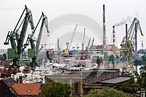 Panorama of the city of Gdansk. Port cranes on the background of city panorama.