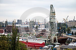 Panorama of the city of Gdansk. Port cranes on the background of city panorama.