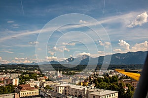 Panorama of the city of Villach with historical churches and a castle in front of the mountains of the Karawanken Mountains in the