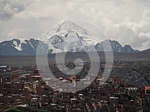 Panorama cityscape landscape of La Paz urban city metropolis with white Huayna Potosi mountain Bolivia South America
