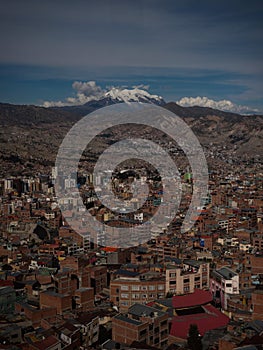 Panorama cityscape landscape of La Paz urban city metropolis with white Illimani mountain Bolivia South America