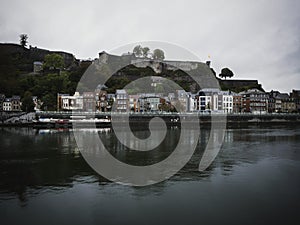 Panorama cityscape view of historic medieval fortress citadel Namur from Meuse Maas river Wallonia Belgium Europe