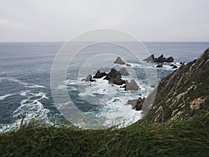 Panorama of cliff coast at El Banco mas bonito del mundo The best bank of the world Loiba bench Ortigueira Galicia Spain