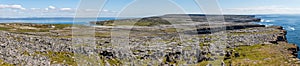 Panorama with Cliffs, Farms, rocks and vegetation in Inishmore with ocean in background