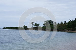 Panorama of the coast of Beachcomber island from the Pacific ocean