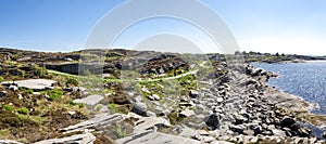 Panorama of a coastline in Kvernevik suburb with a walking footpath