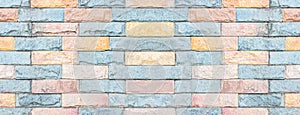 Panorama of color modern stone wall pattern and background
