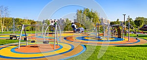 Panorama of colorful large playground in a city park