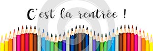 Panorama of colorful pencils on white background with text `c`est la rentree` photo