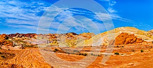 Panorama of the colorful red, yellow and white banded sandstone rock formations along the Fire Wave Trail in the Valley of Fire