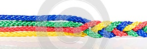 Panorama, colorful ropes are connected, cooperation and cohesion photo