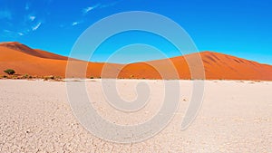 Panorama on colorful sand dunes and scenic landscape at Sossusvlei in the Namib desert, Namib Naukluft National Park, tourist dest