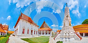 Panorama of courtyard of Wat Mahathat temple with Prang and Ubosot hall, Bangkok, Thailand