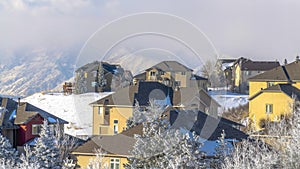 Panorama crop Houses on snow covered Wasatch Mountain setting on a sunny winter day