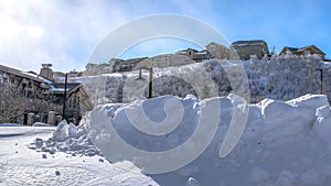 Panorama crop Town nestled amid sweeping terrain of Wasatch Mountain with snow in winter