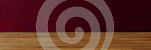 Panorama of dark red background for copy space and wooden table. Minimal design template. Real photo