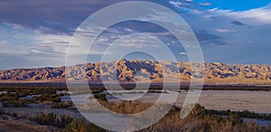 Panorama of desert mountain range and community near Salton Sea, CA.