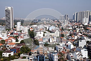 Panorama of district 2 with local houses in foreground and high rise towers in background