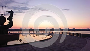 Panorama of Dnieper River bank with statue of Kyiv City Founders, Ukraine