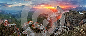 Panorama dramatic sunset in dolomites alp mountain from peak Nuvolau