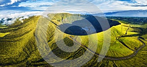 Panorama of drone green sunrise landscape of volcano Gordo caldera in Faial island - Azores, Portugal photo