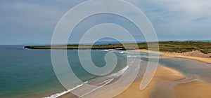 Panorama drone landscape view of the beautiful golden sand beach at Lacken Strand on the coast of North Mayo in Ireland