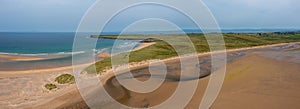 Panorama drone landscape view of the beautiful golden sand beach at Lacken Strand on the coast of North Mayo in Ireland